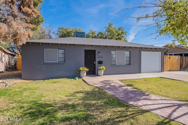 single story home with a garage and a front yard