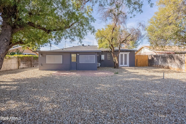 back of house featuring a patio area and french doors