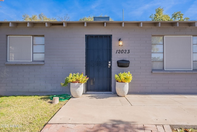 property entrance featuring a patio