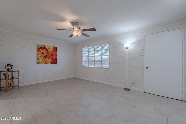 empty room with brick wall and ceiling fan