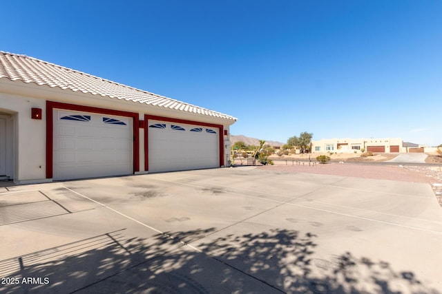 view of property exterior with a garage