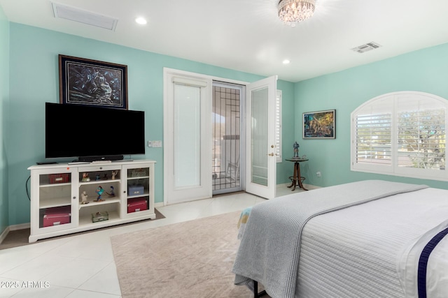 bedroom with access to exterior and light tile patterned flooring