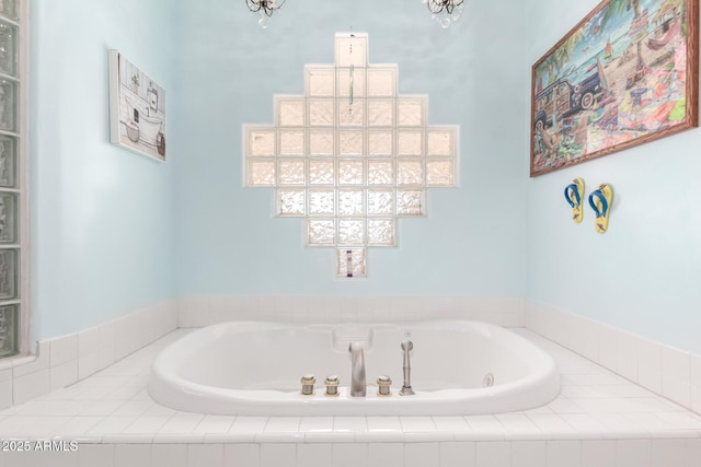 bathroom featuring a relaxing tiled tub