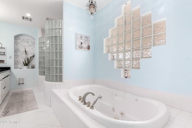 bathroom with tile patterned floors, plus walk in shower, and vanity