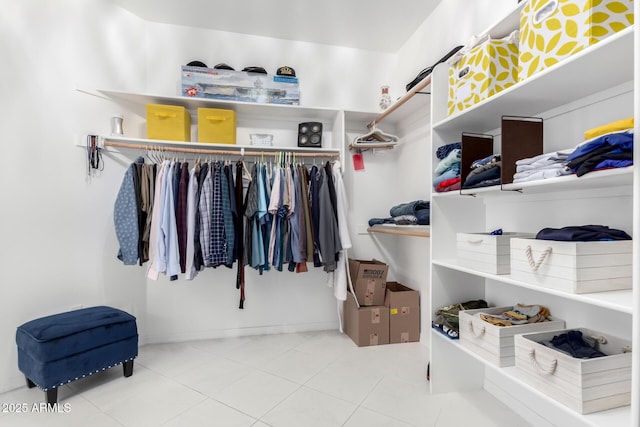 spacious closet with tile patterned floors