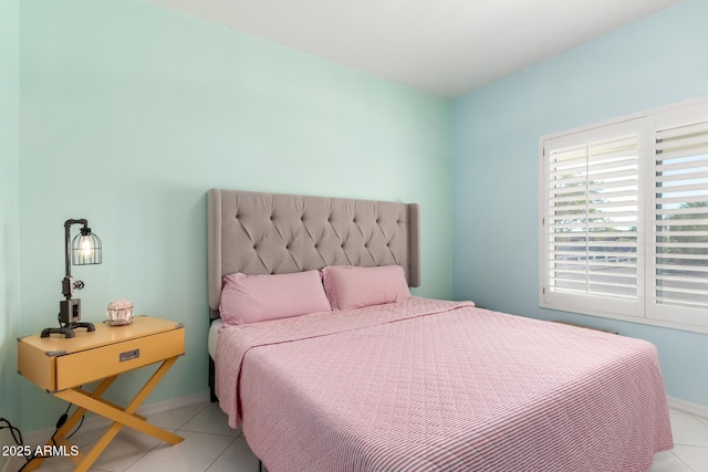 bedroom with light tile patterned flooring