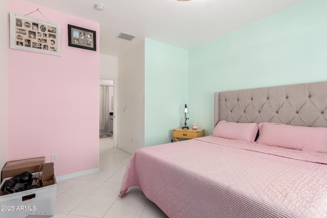 bedroom featuring light tile patterned floors