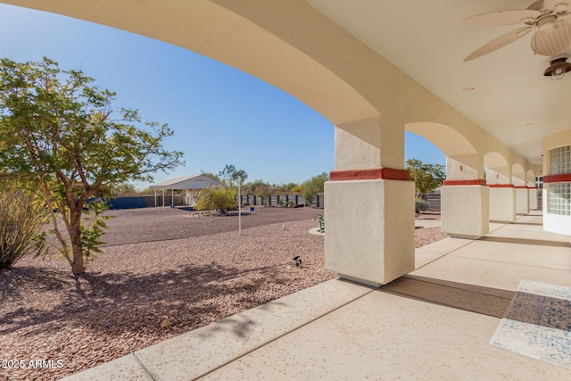 view of patio / terrace featuring ceiling fan