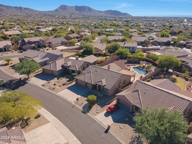 birds eye view of property with a mountain view