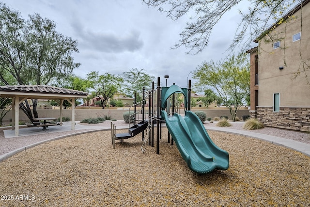 community jungle gym featuring fence