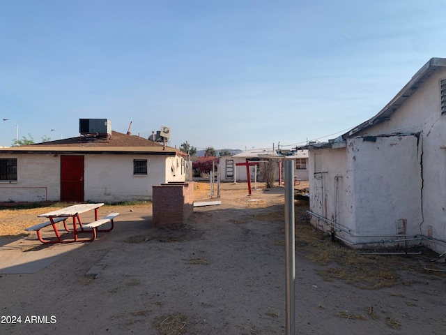 view of yard featuring a patio and central AC