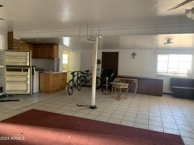 1202 S 14th St, Phoenix, AZ 85034 - kitchen featuring light tile patterned flooring, open floor plan, and brown cabinetry