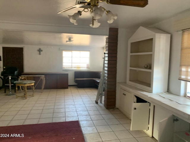 interior space featuring ceiling fan and tile patterned floors