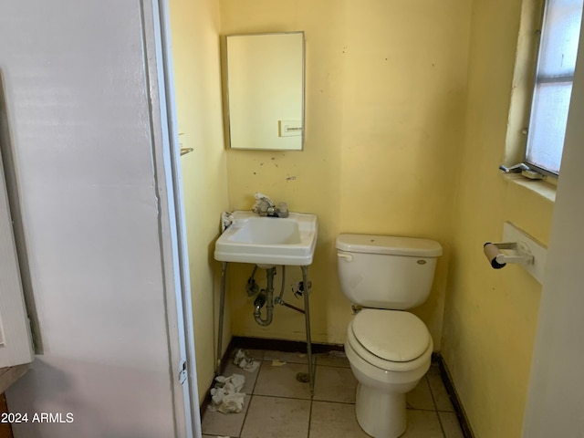 bathroom with tile patterned flooring, toilet, and sink