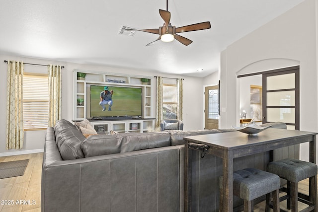 4111 S Dewdrop Ct, Gilbert, AZ 85297 - living room featuring ceiling fan and baseboards