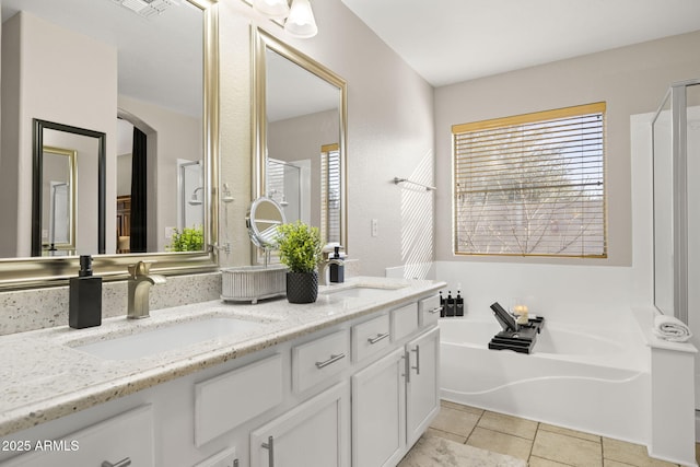 4111 S Dewdrop Ct, Gilbert, AZ 85297 - full bathroom featuring double vanity, a bath, and a stall shower