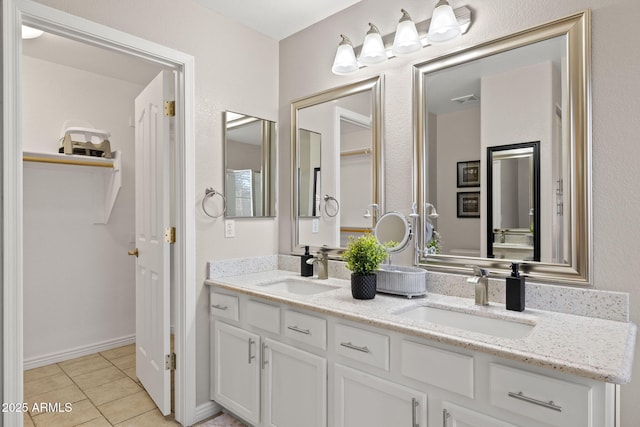 4111 S Dewdrop Ct, Gilbert, AZ 85297 - full bath with double vanity, tile patterned flooring, and a closet