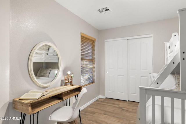 4111 S Dewdrop Ct, Gilbert, AZ 85297 - bedroom featuring wood finished floors and a closet