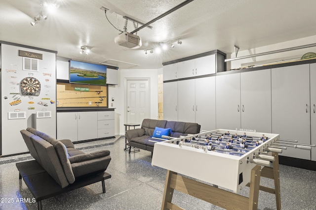 4111 S Dewdrop Ct, Gilbert, AZ 85297 - recreation room featuring light aggregate flooring and a textured ceiling