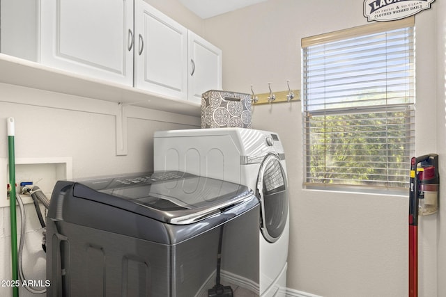 4111 S Dewdrop Ct, Gilbert, AZ 85297 - laundry area featuring washing machine and dryer, cabinet space, and plenty of natural light