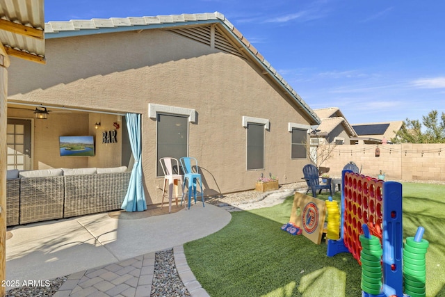 4111 S Dewdrop Ct, Gilbert, AZ 85297 - back of house with an outdoor hangout area, a patio area, and stucco siding