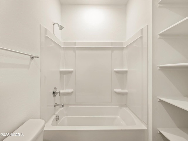 bathroom featuring toilet and shower / bathtub combination