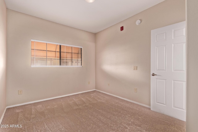 3434 E Baseline Rd Unit 214, Phoenix, AZ 85042 - spare room featuring carpet flooring, baseboards, and a smoke detector