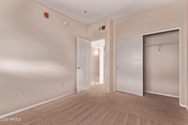 3434 E Baseline Rd Unit 214, Phoenix, AZ 85042 - unfurnished bedroom featuring carpet floors, a closet, and baseboards