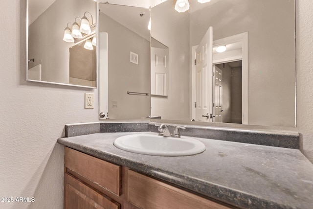 3434 E Baseline Rd Unit 214, Phoenix, AZ 85042 - bathroom featuring vanity and a textured wall