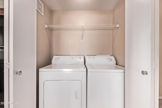 3434 E Baseline Rd Unit 214, Phoenix, AZ 85042 - laundry room featuring separate washer and dryer