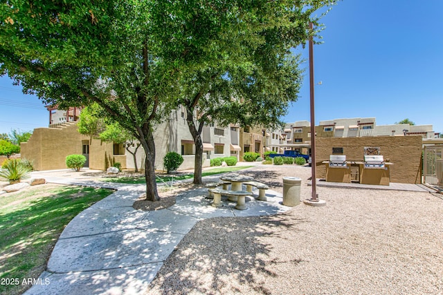 3434 E Baseline Rd Unit 214, Phoenix, AZ 85042 - view of property's community featuring a residential view and an outdoor kitchen