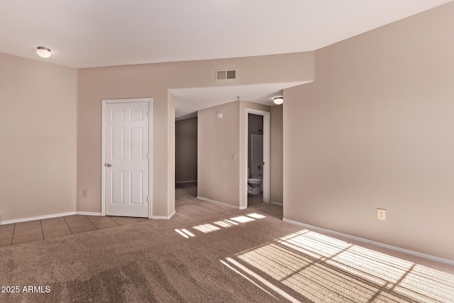 3434 E Baseline Rd Unit 214, Phoenix, AZ 85042 - empty room featuring carpet, baseboards, and tile patterned flooring