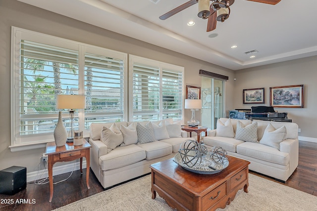 living area with baseboards, visible vents, dark wood finished floors, ceiling fan, and recessed lighting