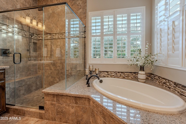 full bathroom featuring a shower stall and a bath