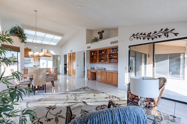 living room featuring high vaulted ceiling, light tile patterned flooring, a textured ceiling, and an inviting chandelier