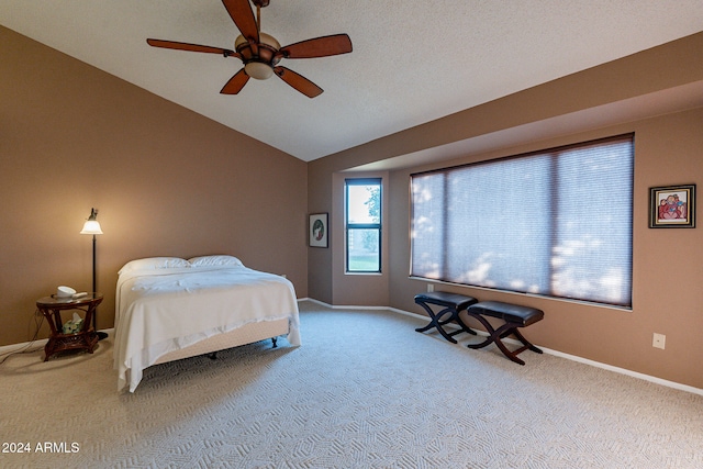 carpeted bedroom featuring vaulted ceiling and ceiling fan