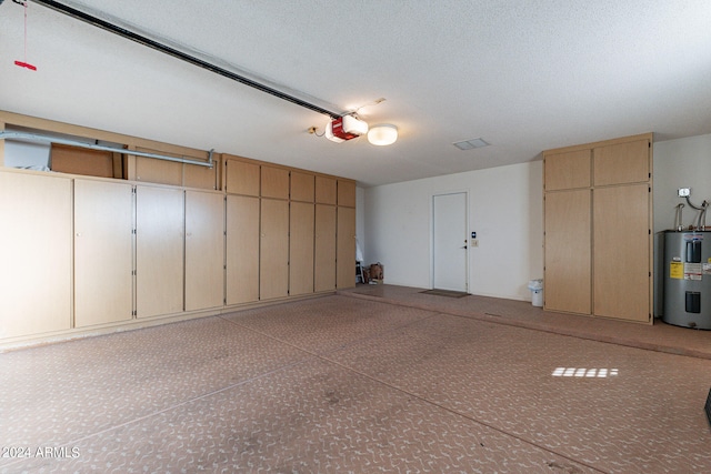 garage with a garage door opener and water heater