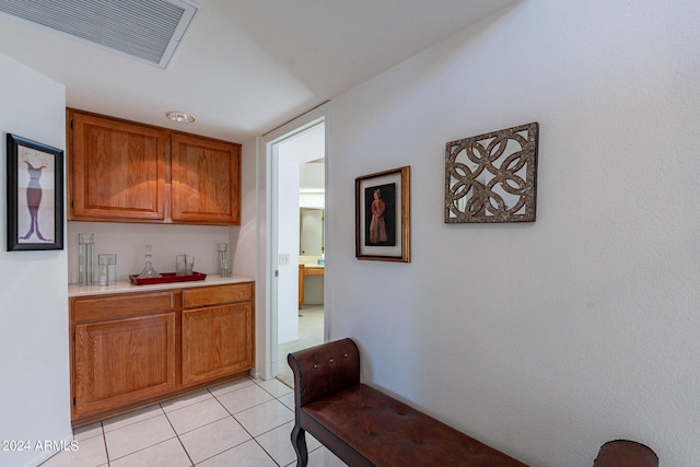 bar featuring light tile patterned flooring