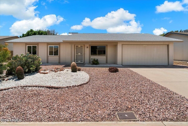 ranch-style home featuring a garage