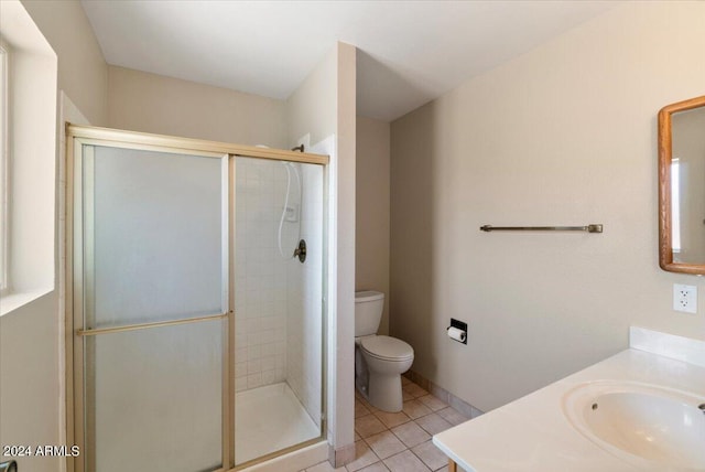 bathroom featuring walk in shower, vanity, and toilet