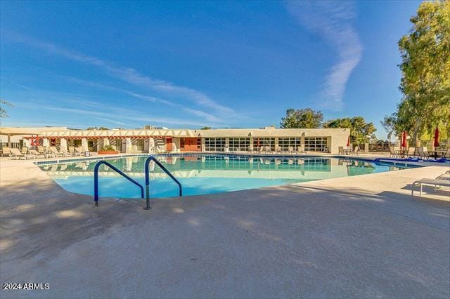 view of pool featuring a patio