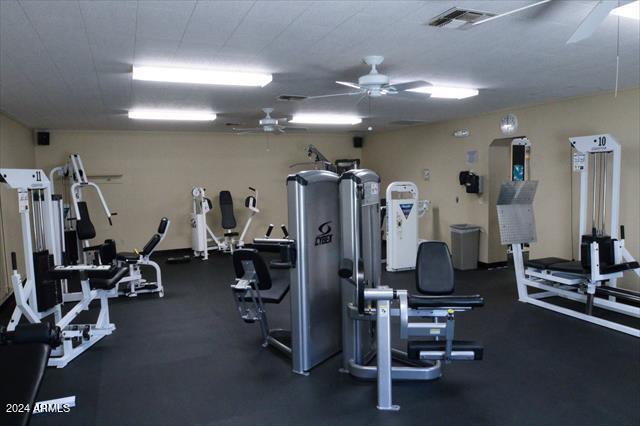 exercise room with ceiling fan