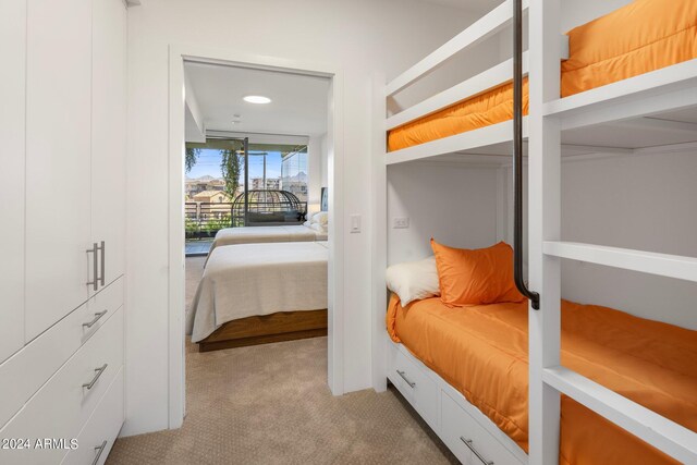 7180 E Kierland Blvd Unit 314, Scottsdale, AZ 85254 - bedroom featuring light carpet and access to outside