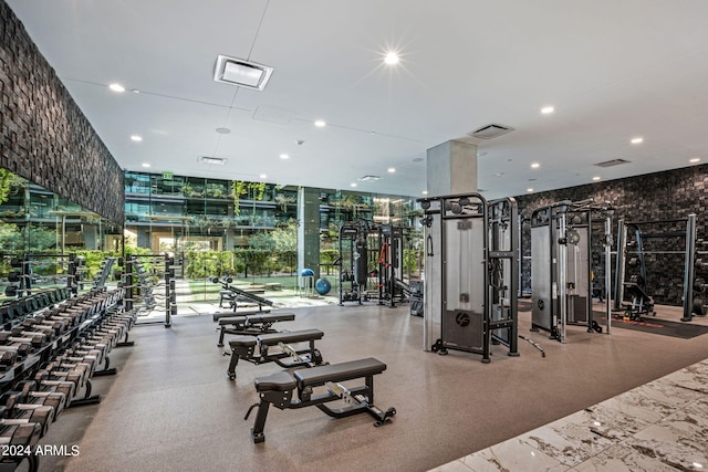 gym with a wall of windows