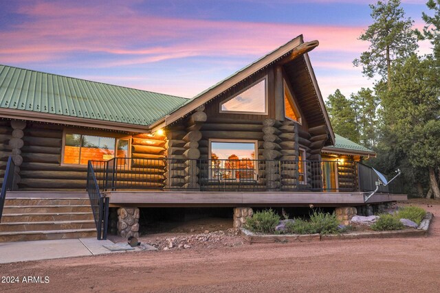703 N Chaparral Pines Dr, Payson, AZ 85541 - back of house with metal roof, a porch, and log exterior