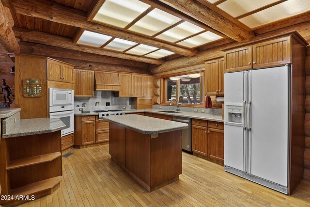 703 N Chaparral Pines Dr, Payson, AZ 85541 - kitchen with rustic walls, white appliances, a sink, beamed ceiling, and light wood finished floors