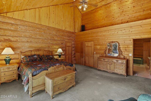 703 N Chaparral Pines Dr, Payson, AZ 85541 - bedroom with carpet flooring, high vaulted ceiling, and log walls