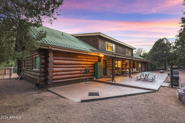 703 N Chaparral Pines Dr, Payson, AZ 85541 - back of house featuring log siding, metal roof, and a patio