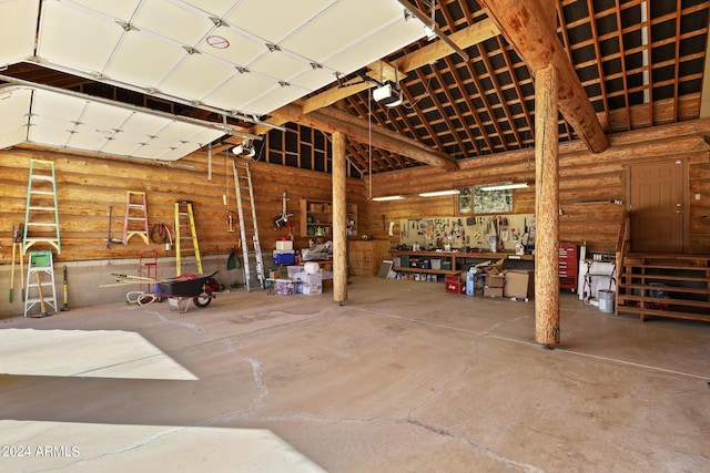 703 N Chaparral Pines Dr, Payson, AZ 85541 - garage with a workshop area and a garage door opener