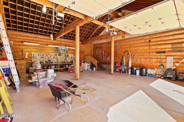 garage with a garage door opener and a workshop area